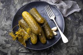 depositphotos_136941790-stock-photo-pickled-cucumbers-in-black-plate.jpg